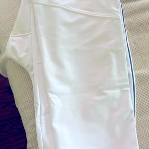 Men's under armor baseball pants, size MD, straight, white w/blue trim. NWT